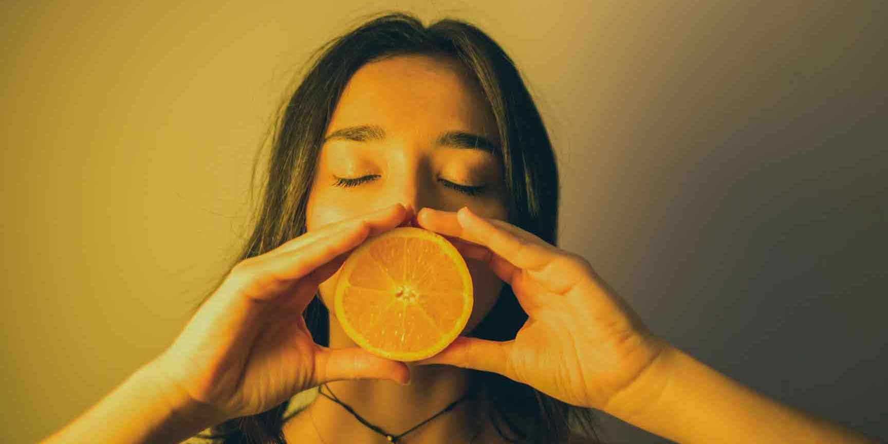Image of girl eating orange for the Skincare Diet